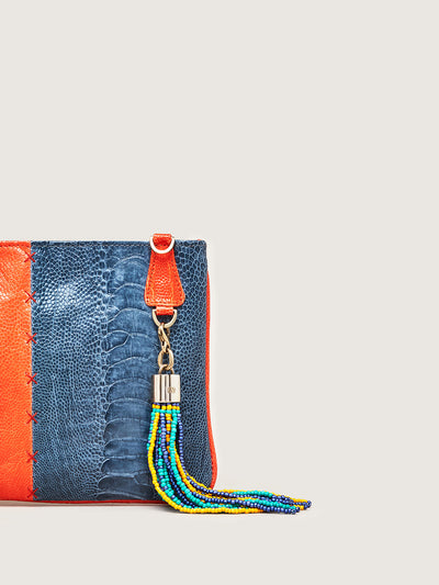 Releve Fashion Okapi Aja Clutch Chilli Red Ahos Blue Jean Ostrich Shin Black Stitching Sustainable Ethical Fashion Brand Positive Luxury Positive Fashion Purchase with Purpose Shop for Good