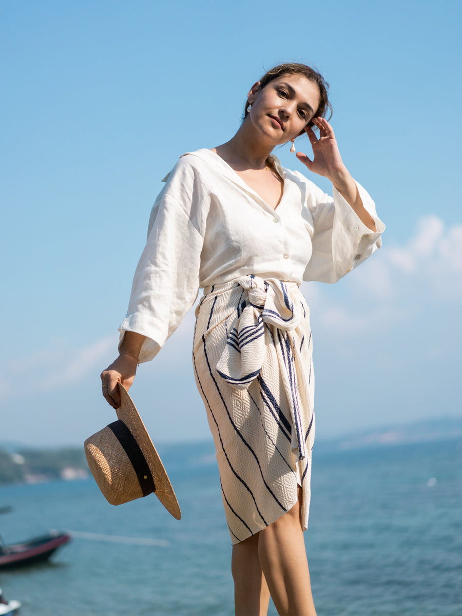 Releve Fashion WVN Living Handwoven Navy Cream Drift Throw Blanket and Towel Sustainable Luxury Fashion Conscious Clothing and Lifestyle Accessories Ethical Designer Brand Artisanal Handcrafted Beachwear Home Accessories Purchase with Purpose Shop for Good