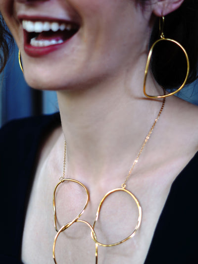 Relevé Fashion Emi & Eve Freedom Dangling Earrings in Gold Made of Recycled Missile Shells Responsible Luxury Conflict-Free Jewellery Ethical and Sustainable Designer Brand Purchase with Purpose Shop for Good