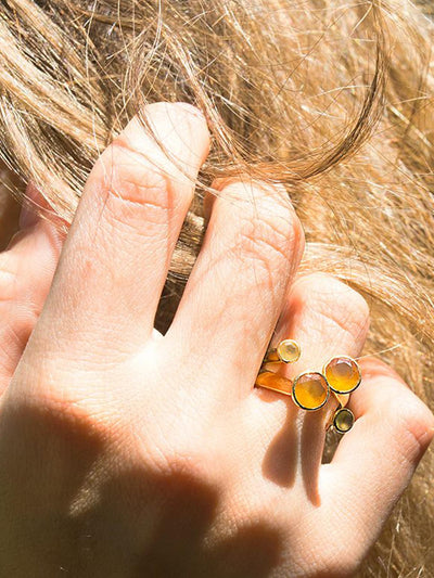 Relevé Fashion Emi & Eve Unity Ring with Carnelian Stones and Gold Made of Recycled Missile Shells Responsible Luxury Conflict-Free Jewellery Ethical and Sustainable Designer Brand Purchase with Purpose Shop for Good