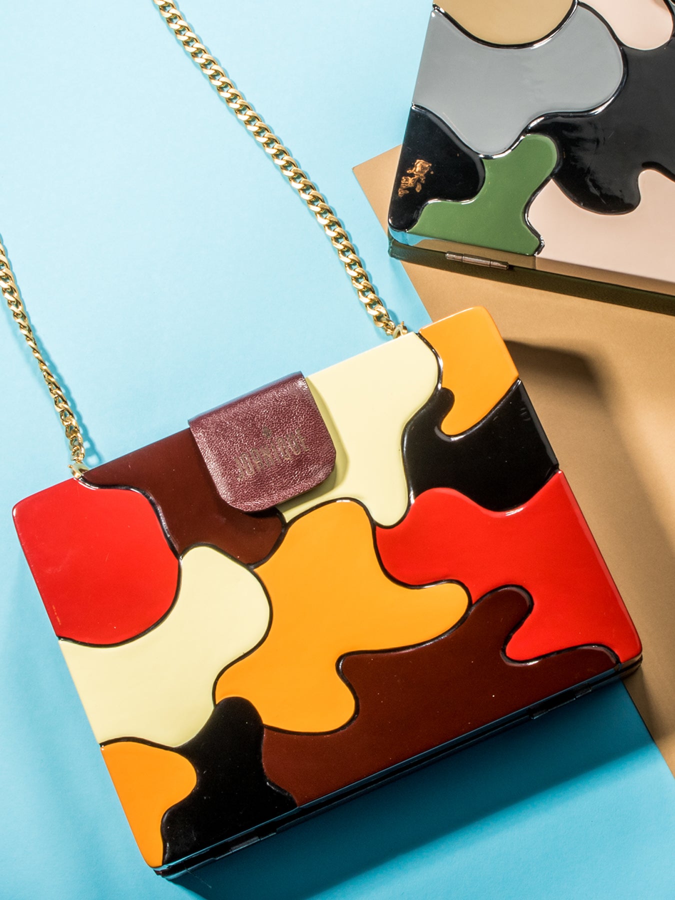 Releve Fashion Joanique Small Aurora Clutch Bag Red Maroon Yellow Orange Ethical Designers Sustainable Fashion Accessory Brand Purchase with Purpose Shop for Good