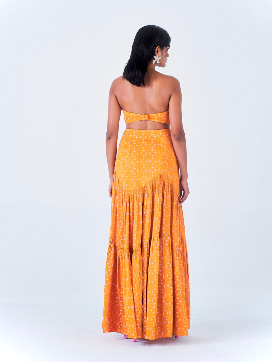 Releve Fashion Little Things Studio Jugnu Rose Fibre Fabric Strapless Cropped Top and Maxi Skirt Co-ord in Orange and Off-White Geometric Print Ethical Luxury Brand Sustainable Clothing Conscious Fashion Purchase with Purpose Shop for Good