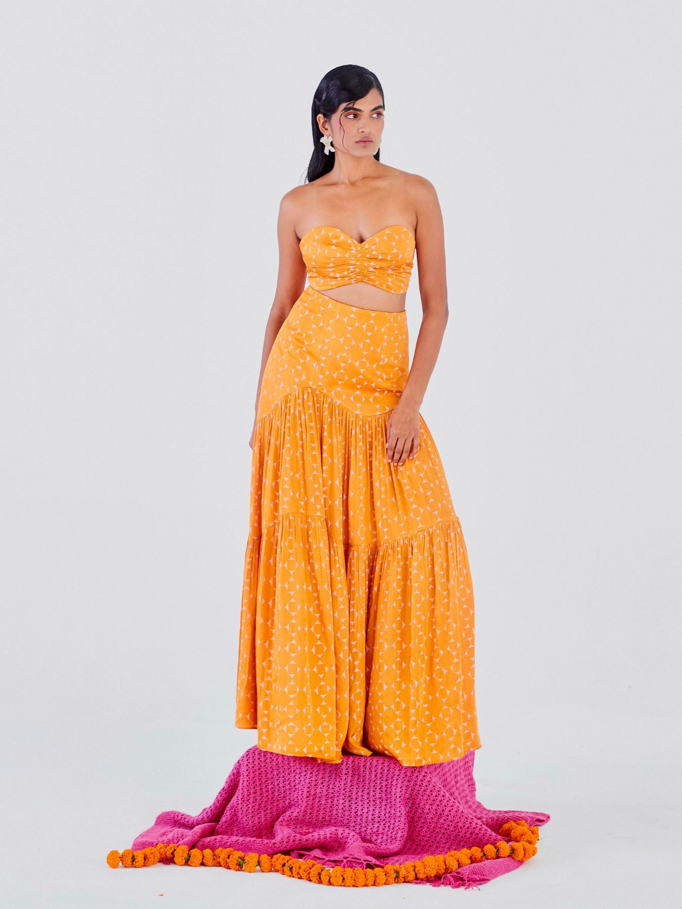 Releve Fashion Little Things Studio Jugnu Rose Fibre Fabric Strapless Cropped Top and Maxi Skirt Co-ord in Orange and Off-White Geometric Print Ethical Luxury Brand Sustainable Clothing Conscious Fashion Purchase with Purpose Shop for Good
