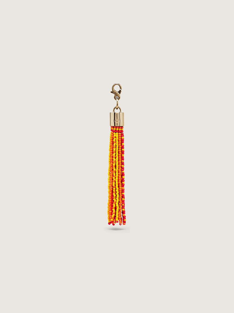 Releve Fashion Okapi Clip On Beaded Tassel Bag Charm Red Yellow Orange Sustainable Ethical Fashion Brand Positive Luxury Positive Fashion Purchase with Purpose Shop for Good