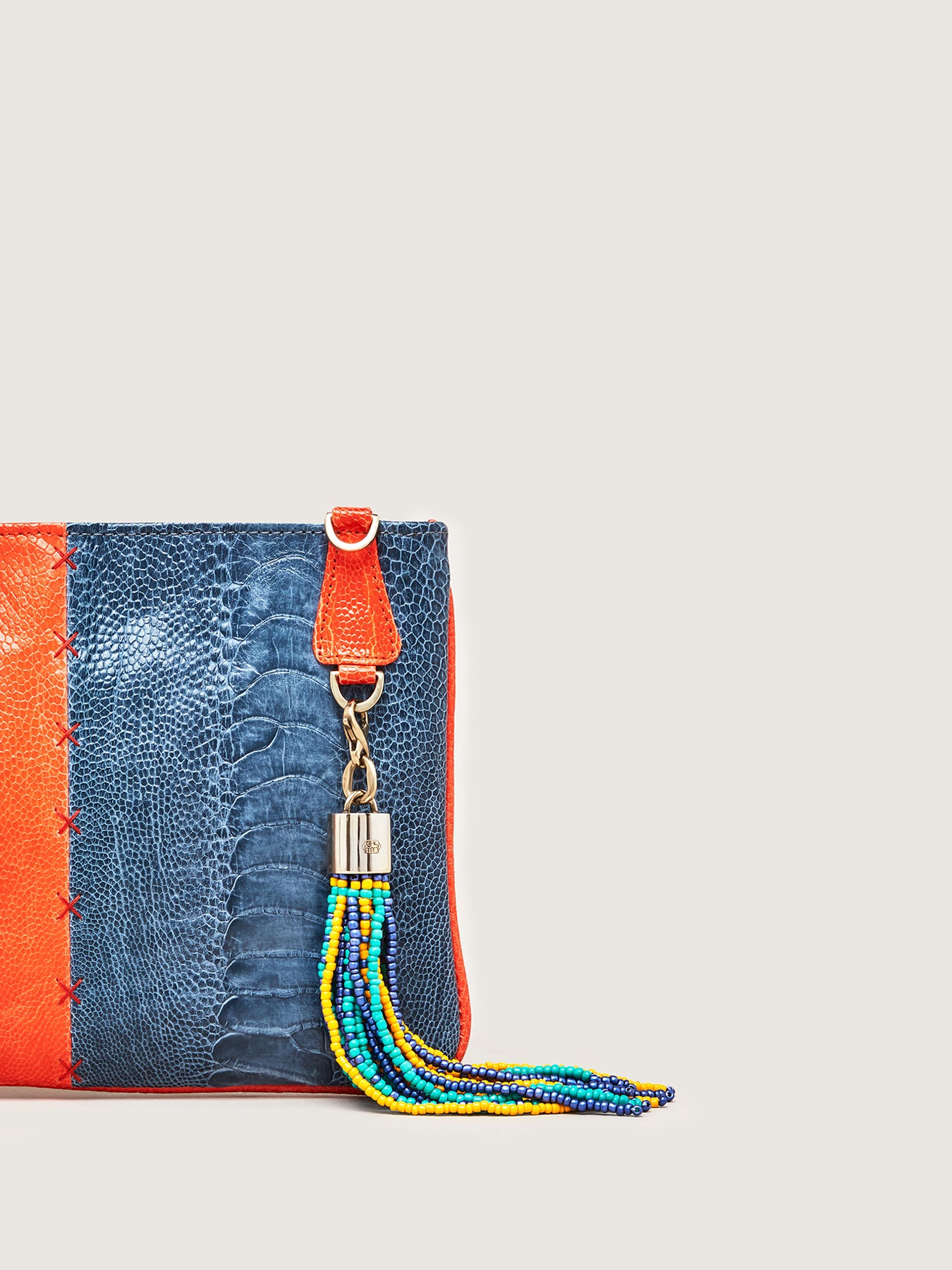 Releve Fashion Okapi Aja Clutch Chilli Red Ahos Blue Jean Ostrich Shin Black Stitching Sustainable Ethical Fashion Brand Positive Luxury Positive Fashion Purchase with Purpose Shop for Good