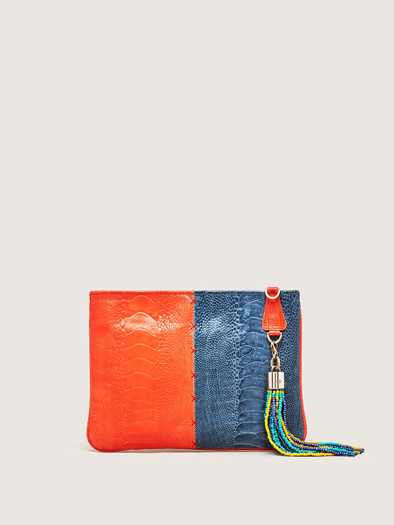 Releve Fashion Okapi Aja Clutch Chilli Red Ahos Blue Jean Ostrich Shin Black Stitching Sustainable Ethical Fashion Brand Positive Luxury Positive Fashion Purchase with Purpose Shop for Good