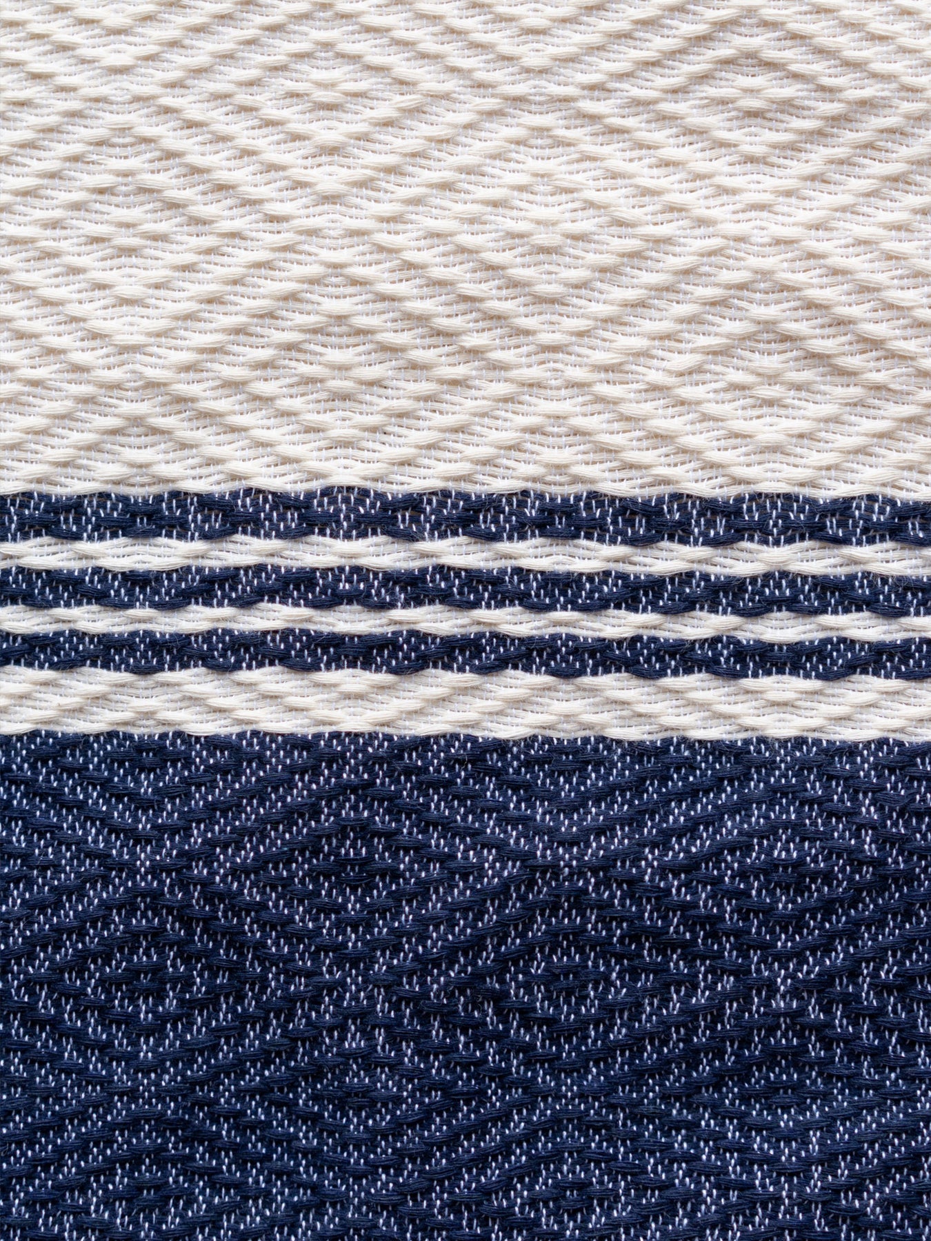 Releve Fashion WVN Living Handwoven Navy Cream Coast Throw Blanket and Towel Sustainable Luxury Fashion Conscious Clothing and Lifestyle Accessories Ethical Designer Brand Artisanal Handcrafted Beachwear Home Accessories Purchase with Purpose Shop for Good