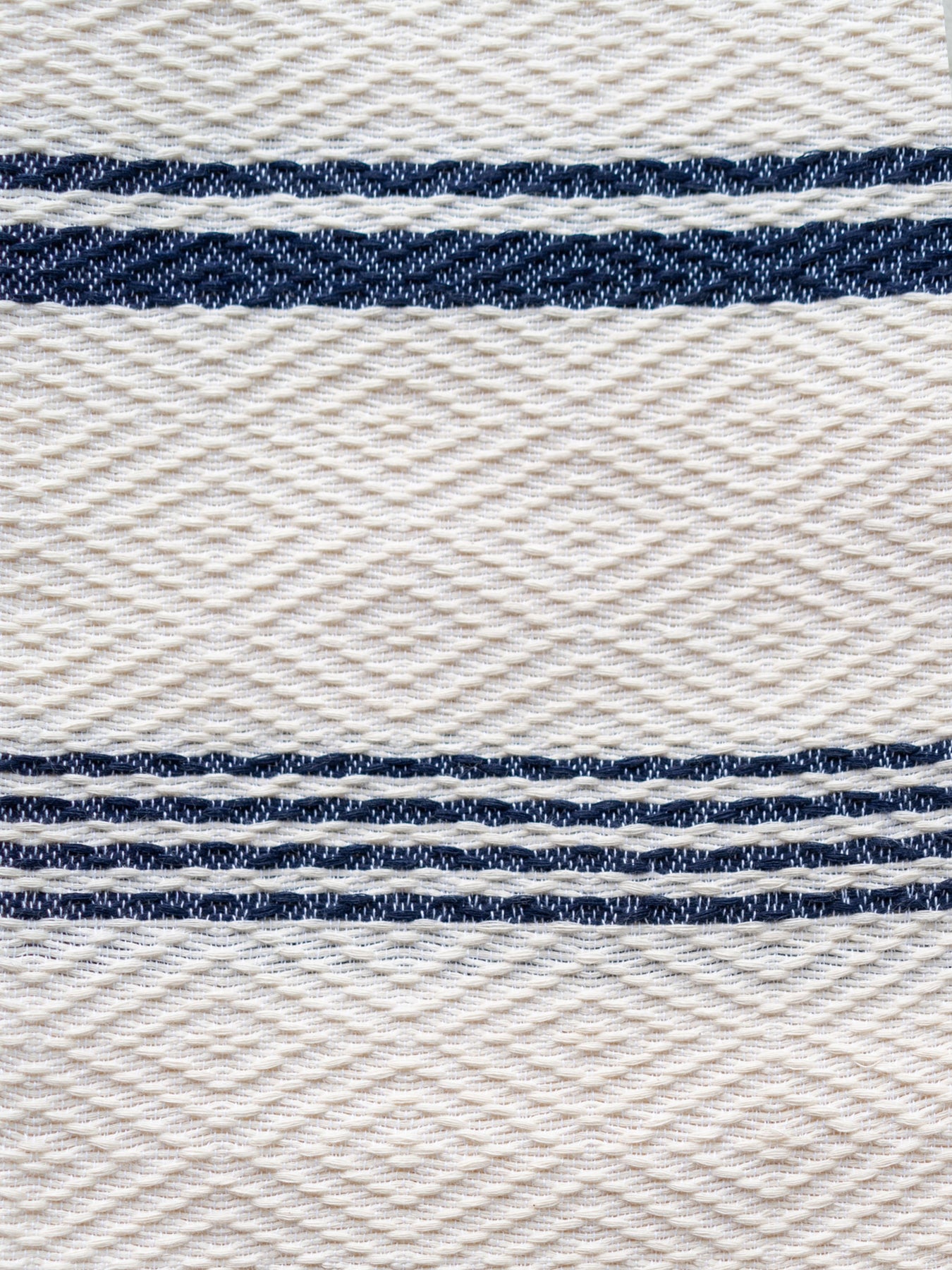 Releve Fashion WVN Living Handwoven Navy Cream Drift Throw Blanket and Towel Sustainable Luxury Fashion Conscious Clothing and Lifestyle Accessories Ethical Designer Brand Artisanal Handcrafted Beachwear Home Accessories Purchase with Purpose Shop for Good